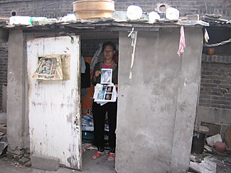 Wang Cuiying has petitioned the government to try a prime suspect in her daughter's murder case for four years from this concrete shack.