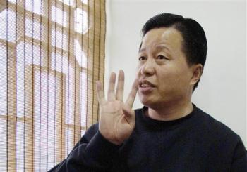 Gao Zhisheng gestures during an interview at a tea house in Beijing in this Feb. 24, 2006