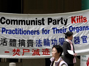 A banner is displayed by members of the human rights support network 'Free China' outside the Sydney offices of the Australian Prime Minister John Howard, 21 September 2007. Free China were holding a public address to media to respond to Australia's, 19 September ruling, that they would not boycott the 2008 Beijing Olympics over China's human rights record. (Greg Wood/AFP/Getty Images)