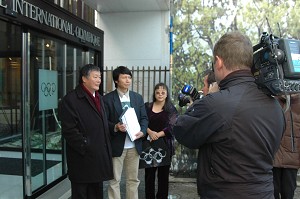 In front of the International Olympic Committee, facing Media